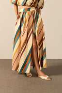 Model wearing the Organic Stripes Long Skirt  unique color detail from the HS25 with 97% Cotton 03% Elastane styled for a lunch look.   