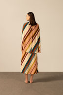 Model wearing the Organic Stripes Midi Dress unique color back from the HS25 with 100% Viscose styled for a lunch look.  