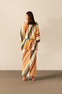 Model wearing the  Organic Stripes Peplum Midi Dress unique color back from the HS25 with 56% Viscose 44% Linen styled for a lunch look.  
