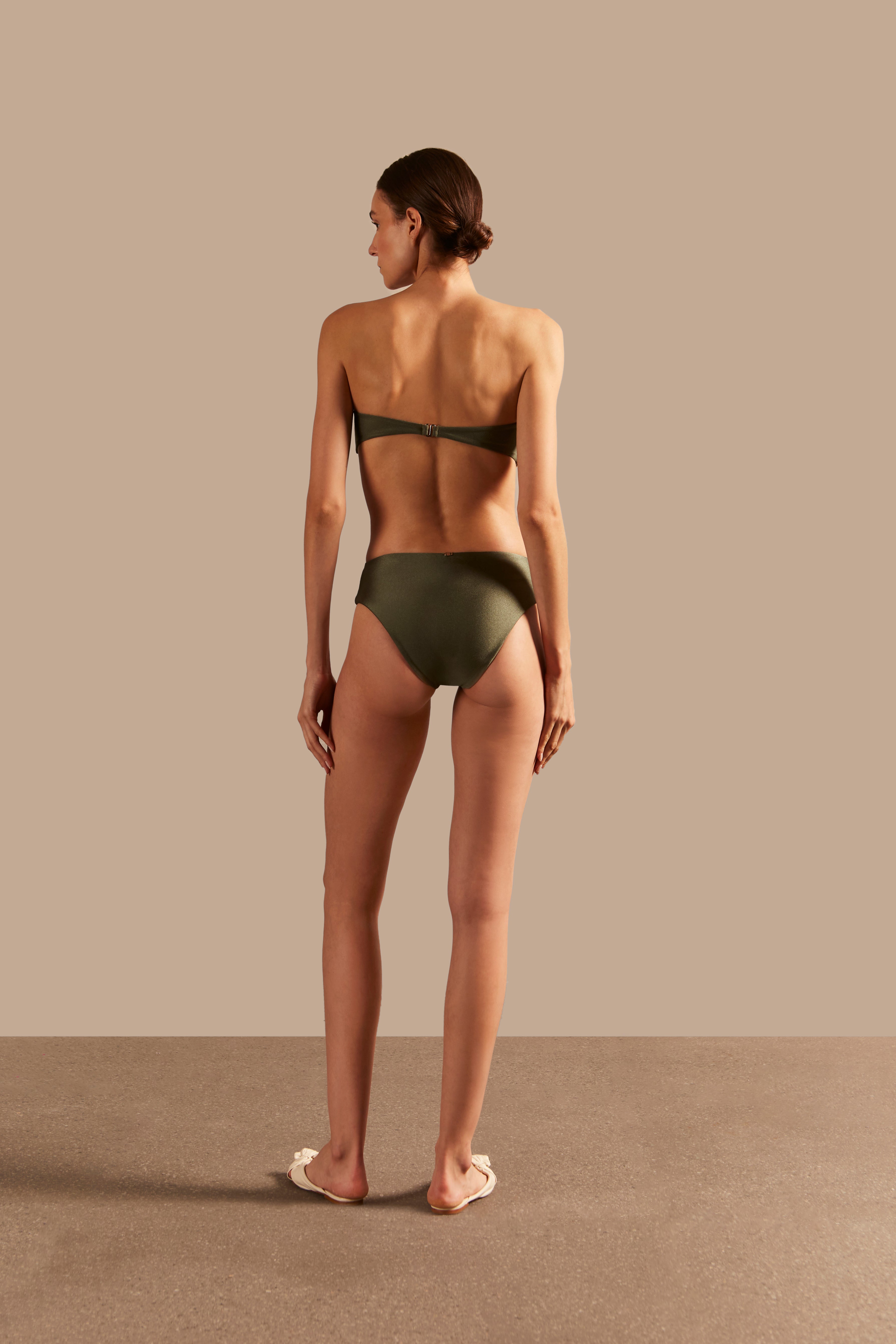 Model wearing the Oyster Hot Pants 3D Bikini Back showcasing its Croco Green color on 85% polyamide 15% spandex fabric.