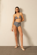 Model wearing the Pois High-Waisted Triangle Bikini front styled for a beach look