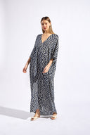 Model wearing the Pois Long Kaftan front navy styled for a resort look