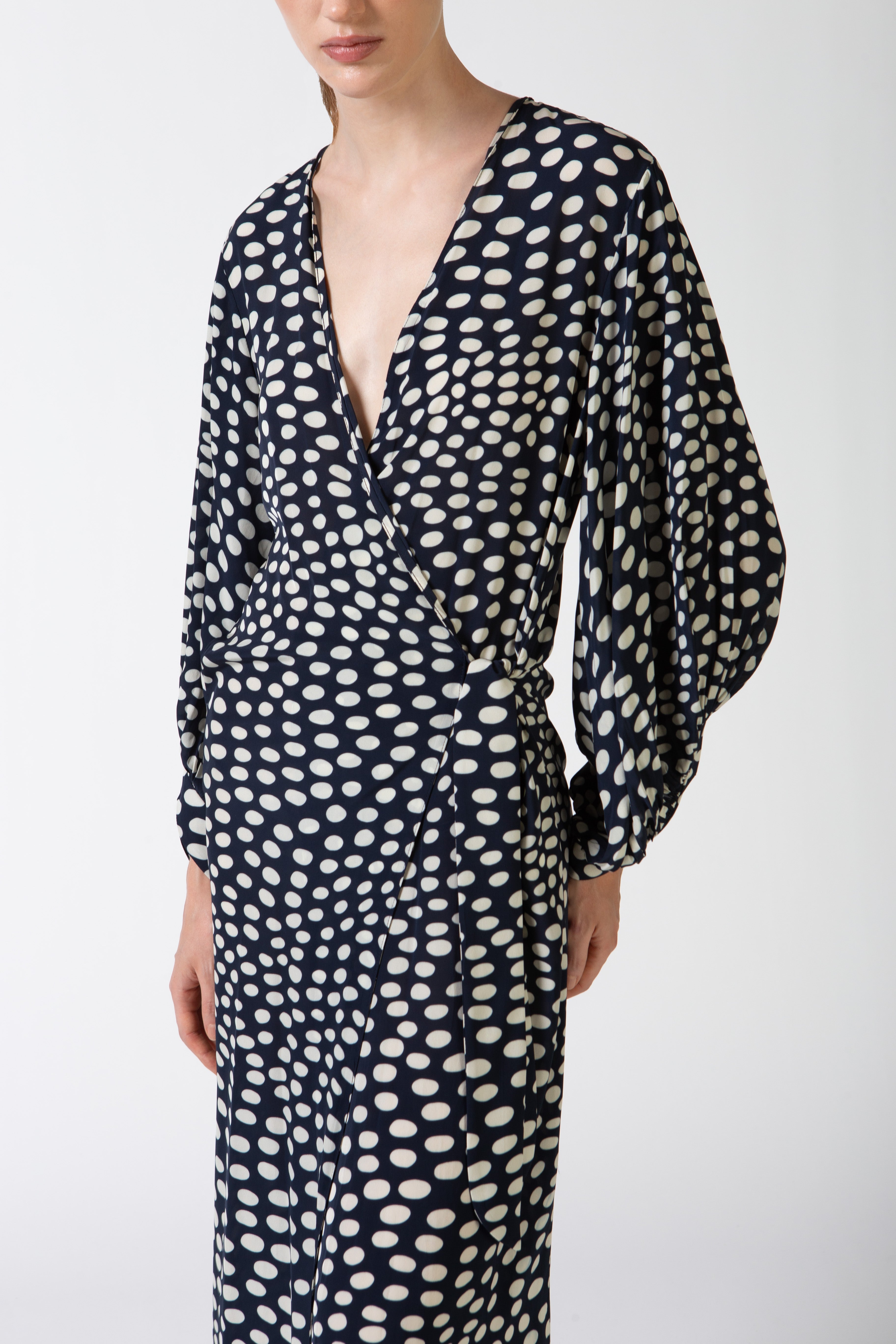 Model wearing Pois Puff-Sleeved Long Robe detail color navy, made from 100% viscose, styled for a resort look