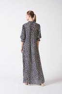 Model wearing Pois Short-Sleeved Long Dress back color navy, made from 100% viscose, styled for a resort look
