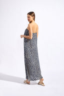 Model wearing the Pois Strapless Long Dress back with 100% viscose fabric styled for a resort look