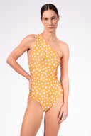 Model wearing the Polka Dots One-Shoulder Swimsuit front color cashew yellow, made from 85% polyamide 15% elastane, styled for a beachwear look