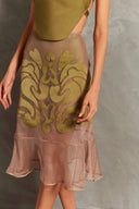 Model wearing the Réseau Appliqué Midi Skirt Concept showcasing its Unique color on 100% Polyester fabric.  