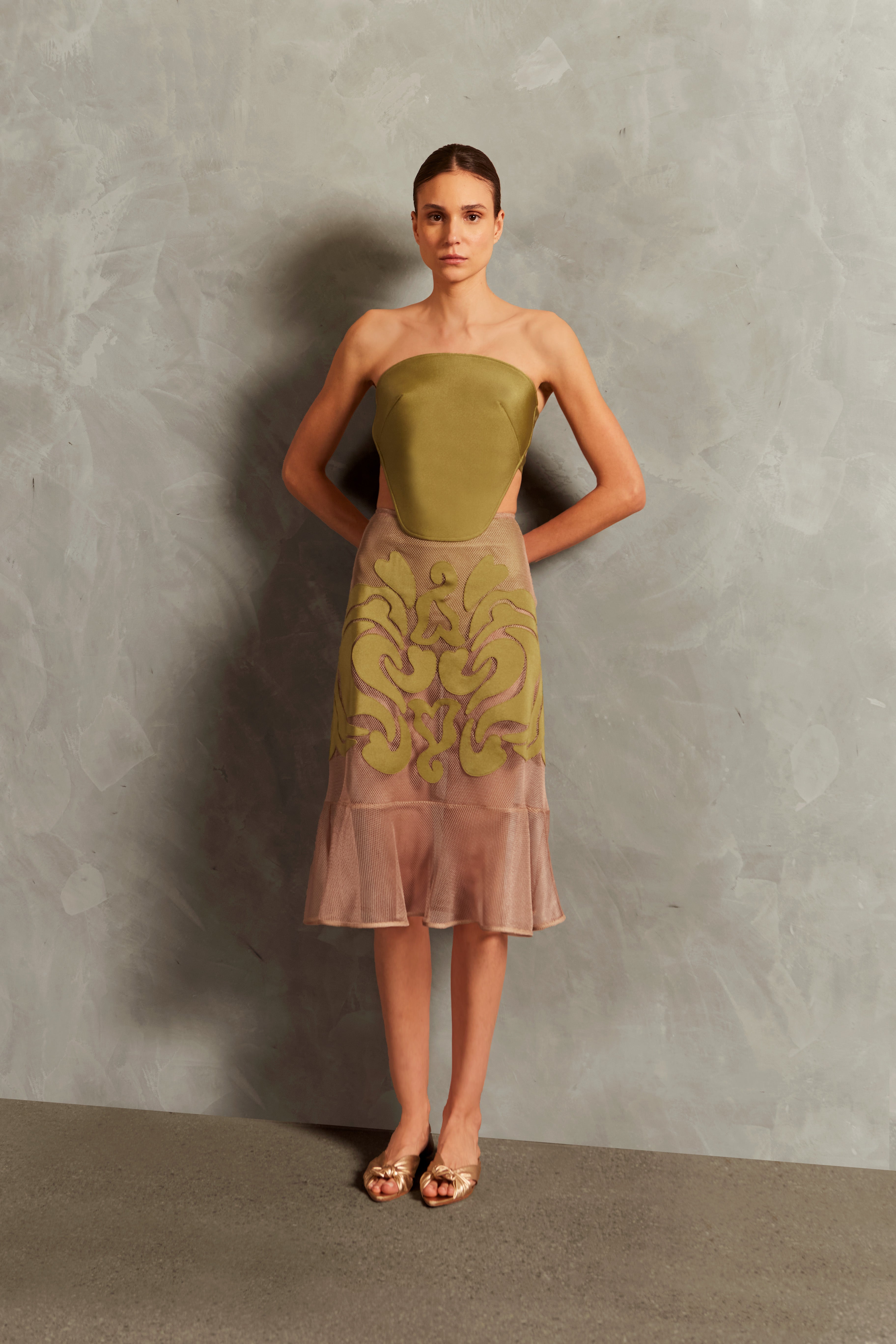 Model wearing the Réseau Appliqué Midi Skirt Front showcasing its Unique color on 100% Polyester fabric.  