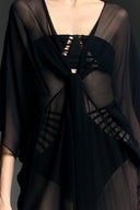 Model wearing the Ruched Sheer Mini Dress detail from the Adriana Degreas and Sabine Getty collab with 100% Silk styled for a casual look. 