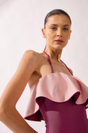 Model wearing the Ruffled Halterneck Swimsuit detail, made from 85% polyamide 15% elastane, styled for a beachwear look