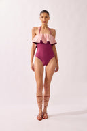 Model wearing the Ruffled Halterneck Swimsuit front, made from 85% polyamide 15% elastane, styled for a beachwear look