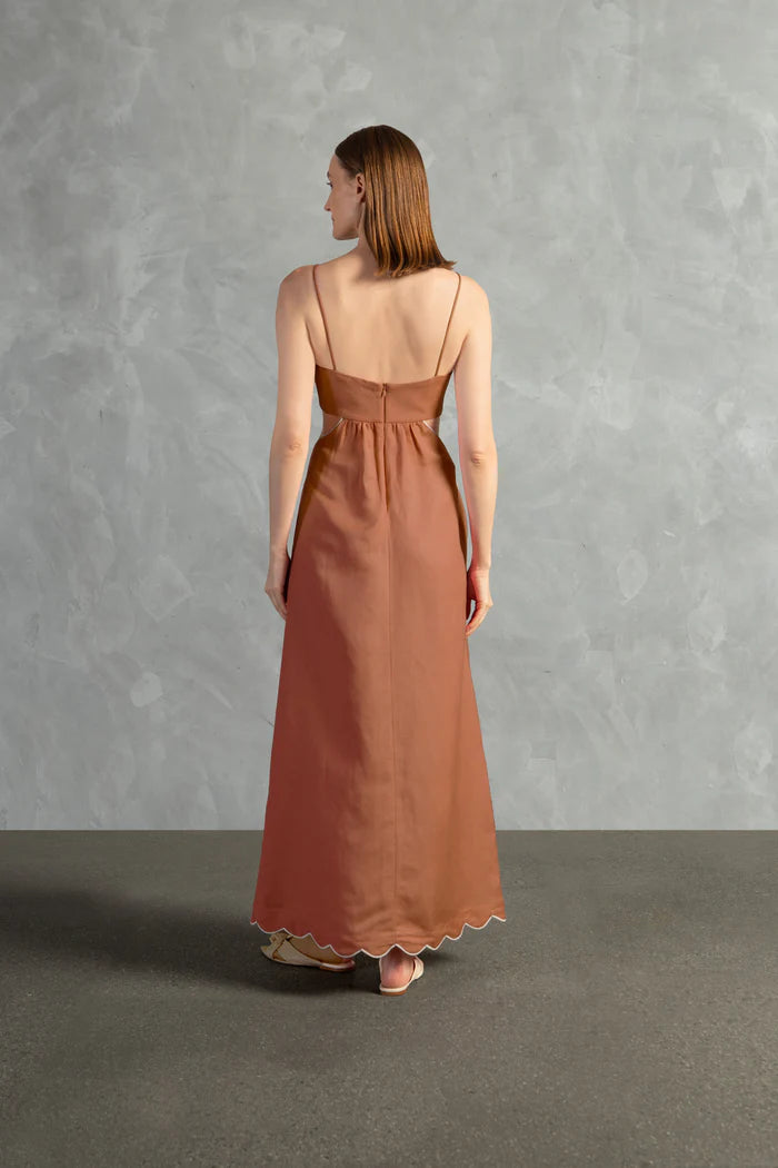 Model wearing the Seashell Solid Cut-Out Long Dress Back color Cognac styled for a resort look