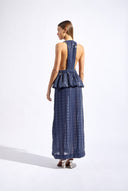 Model wearing the Sequin Deep V-Neck Peplum Maxi Dress back color navy made from 100% polyester fabric, styled for a resort look