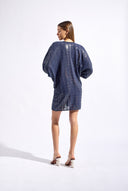 Model wearing the Sequin Front Tie Mini Kaftan back color navy made from 100% polyester, styled for a soiree look