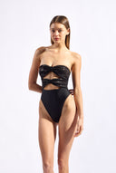 Model wearing the Sequin High-Leg Strapless Swimsuit look color black made from 96% polyester 4% elastane, styled for a beachwear look