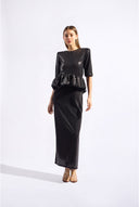 Model wearing the Sequin Peplum Maxi Dress color black made from 100% plyester, styled for an evening look