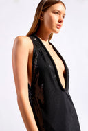 Model wearing the Sequin Plunge Maxi Dress front color black made with 96% Polyester 4% Elastane fabric, styled for a dinner look 