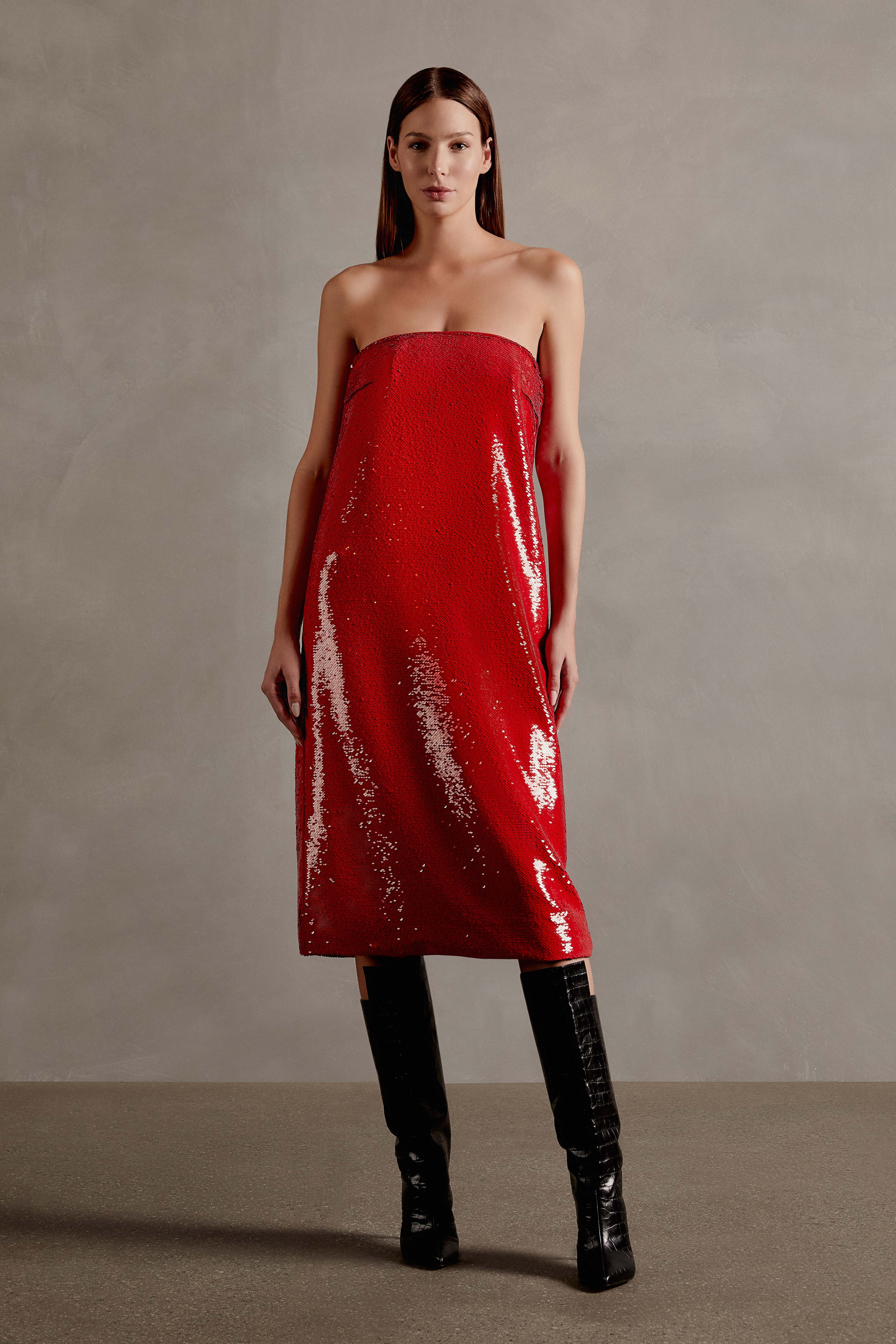 Model wearing the Sequins Midi Dress Front showcasing its Red print on 98% Polyester 2% Elastane fabric, styled for an evening look. 