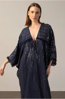 Model wearing the Sequins Maxi Kaftan  detail navy color front from the HS25 with 100% polyester styled for a drinks at the boat look.  