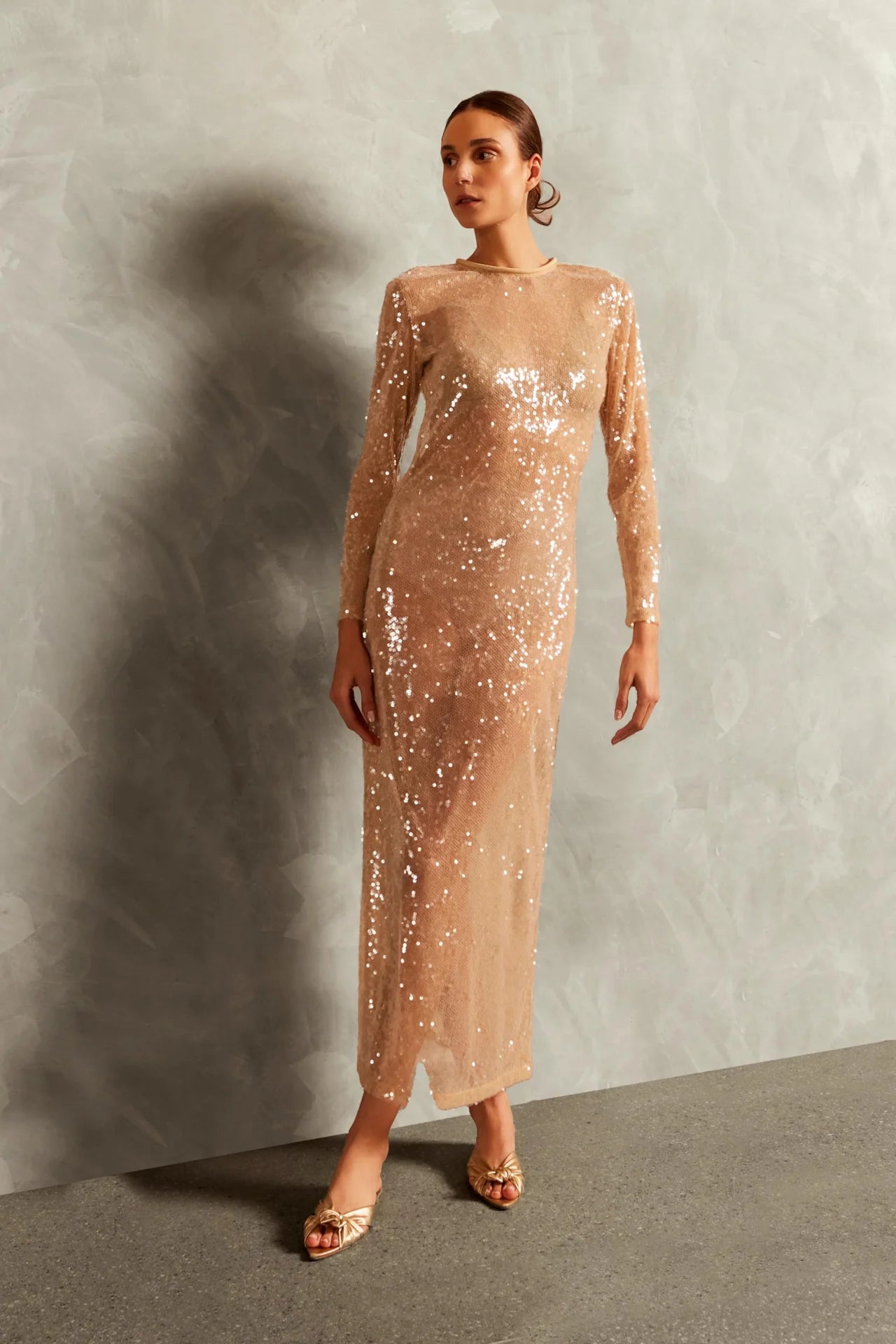 Model wearing the Sequins Open-Back Long Dress with 100% polyester fabric styled for a dinner look