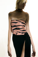 Model wearing the Side-Tie Maxi Skirt black detail from the Adriana Degreas and Sabine Getty collab with 100% Silk styled for a casual look.