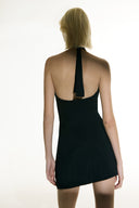 Model wearing the  Side-Tie Sheer Mini Skirt black back from the Adriana Degreas and Sabine Getty collab with 100% Silk styled for a party look. 