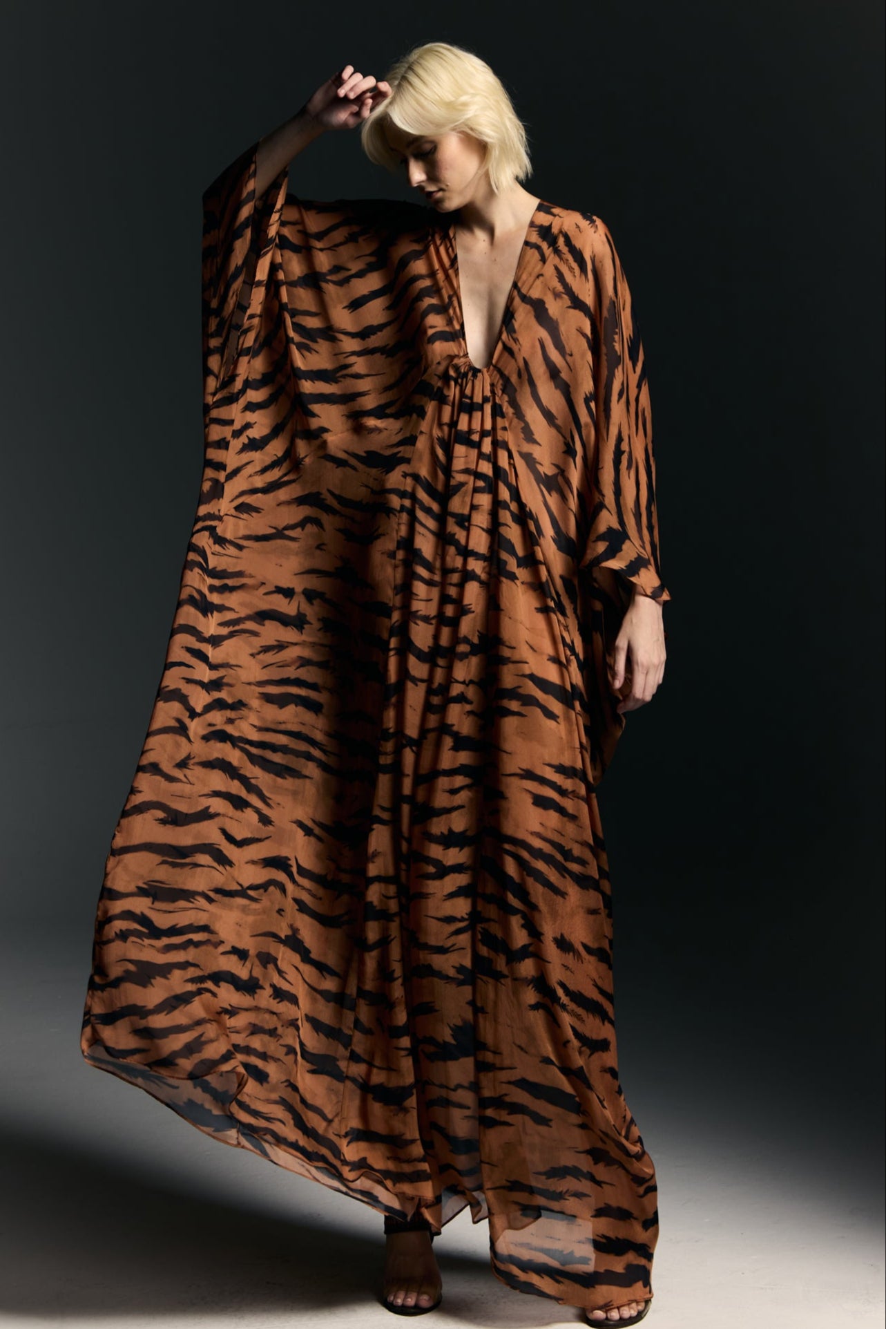 Model wearing the Silk Maxi Kaftan front from the Adriana Degreas and Sabine Getty collab with 100% Silk styled for an evening look.