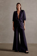 Model wearing the Solid Shirt With Voluminous Sleeves color dark blue front with 100% linen fabric, styled for a dinner look.