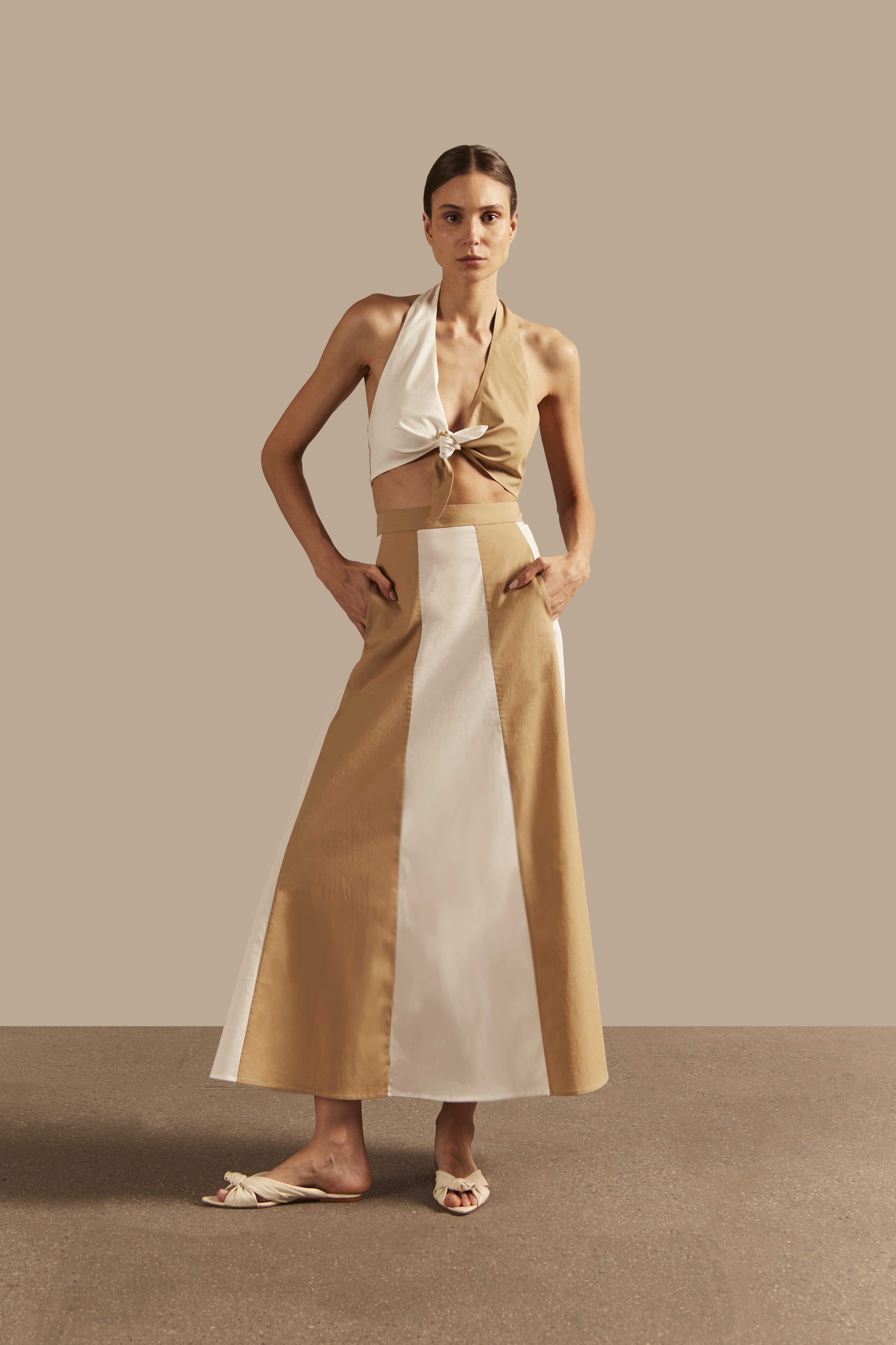 Model wearing the Solid Giardino Top & Skirt Set Front showcasing its Off White color on 98% Viscose 2% Elastane fabric, styled for an resort look.