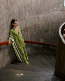 Model wearing the Solid-Green-Long-Kaftan-With-Sash-Concept styled for a resort look