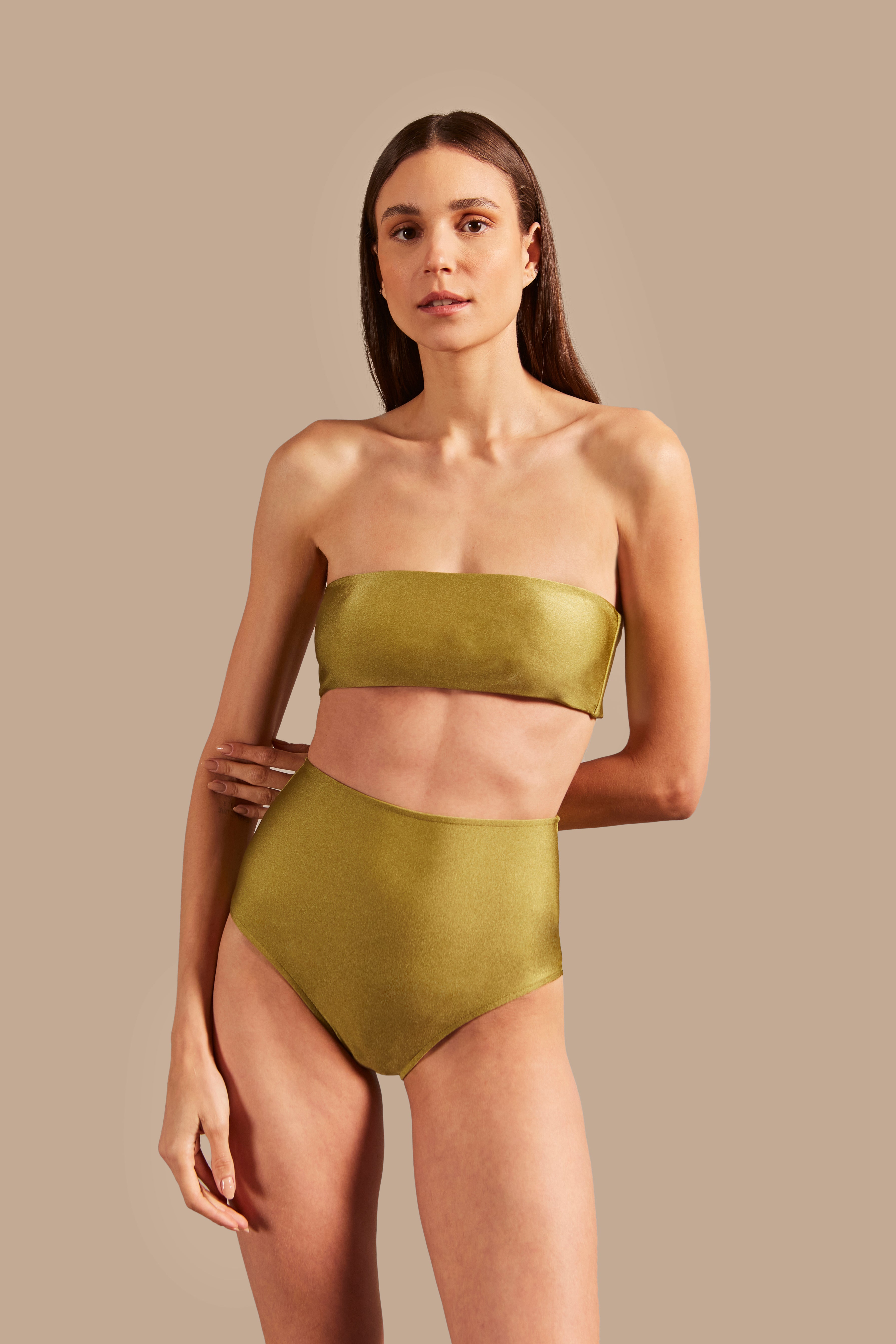 Model wearing the Solid High-Waisted Bandeau Bikini Front showcasing its Pistachio color on 85% polyamide 15% elastane fabric.