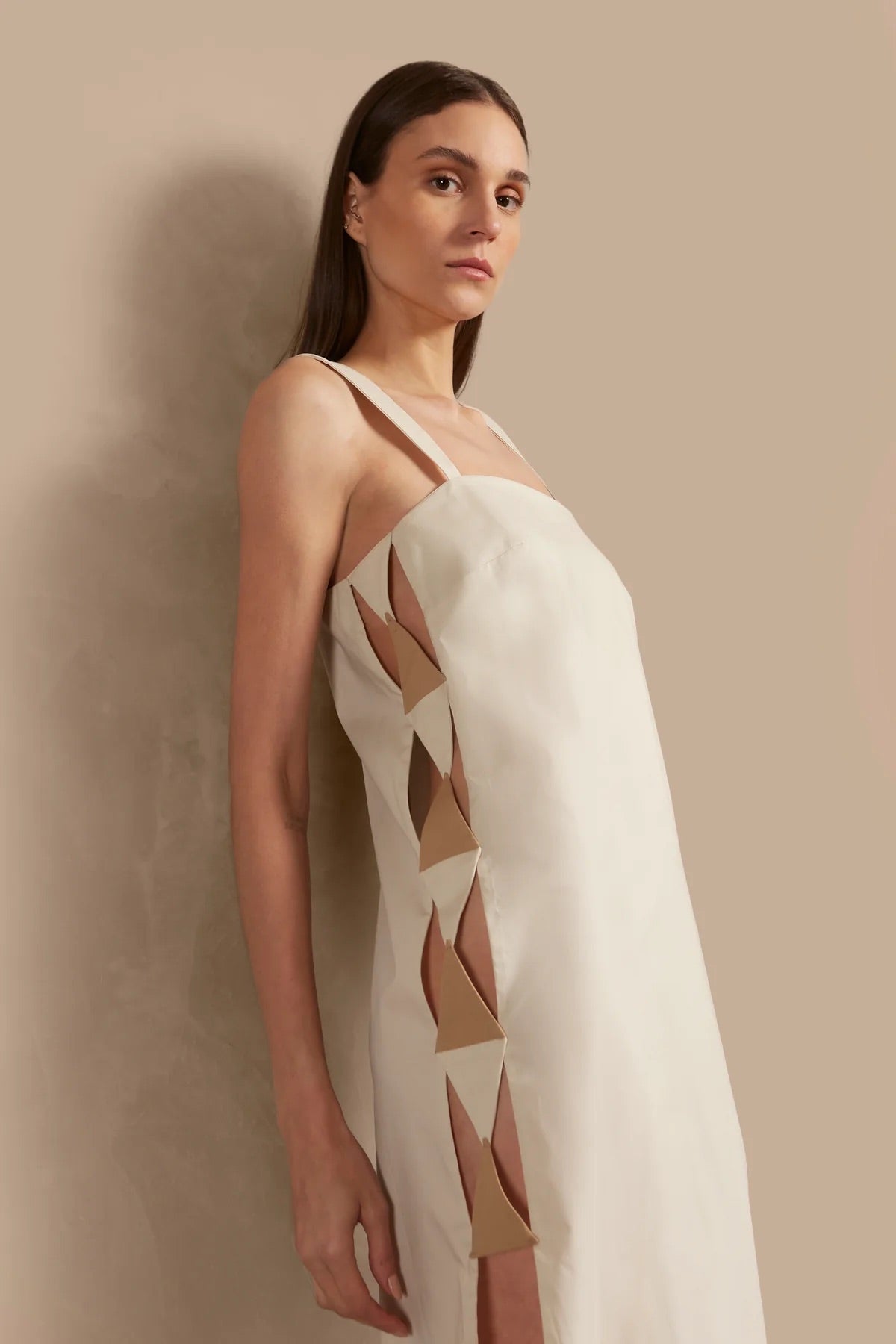 Model wearing the Solid Cut-Out Long Dress Detail showcasing its Off White print on 98% Cotton 2% Spandex fabric, styled for an afternoon look.