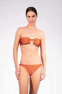 Model wearing the Solid Bandeau Bikini front color cognac made from 85% plyamide 15% elastane, styled for a beachwear look