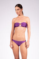 Model wearing the Solid Bandeau Bikini front color purple made from 85% plyamide 15% elastane, styled for a beachwear look