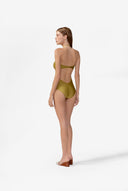 Model wearing the Solid Chain Halterneck Swimsuit back color pistachio made from 85% polyamide 15% elastane, styled for a beachwear look