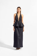 Model wearing the Solid Deep V-Neck Peplum Maxi Dress front color black made with 97% Cotton 3% Elastane, styled for resortwear look