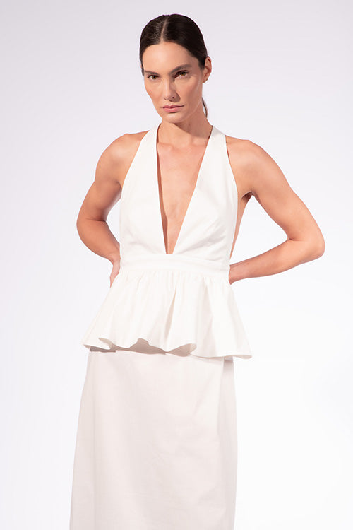 Model wearing the Solid Deep V-Neck Peplum Maxi Dress front color off white made with 97% Cotton 3% Elastane, styled for resortwear look