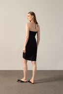 Model wearing the Solid Frilled Midi Dress back color black made from 85% polyamide 15% elastane, styled for a dinner look
