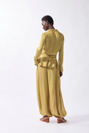 Model wearing the Solid Front-Tie Shirt back color pistachio, made from 100% viscose, styled for a dinner look
