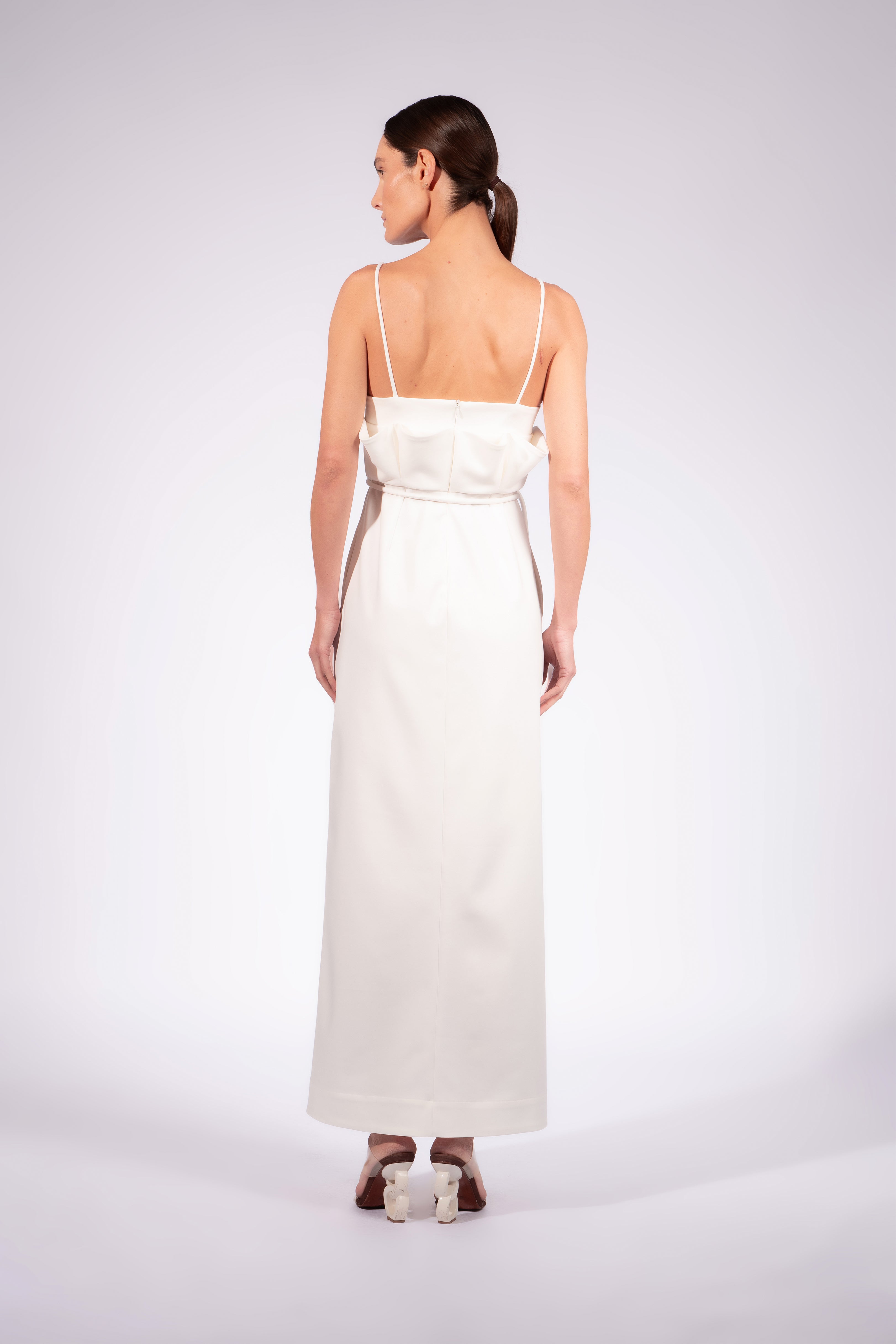 Model wearing the Solid Maxi Dress front back color off white made with 52% Cotton 45% Polyamide 3% Elastane, styled for resortwear look