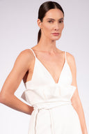 Model wearing the Solid Maxi Dress front detail color off white made with 52% Cotton 45% Polyamide 3% Elastane, styled for resortwear look