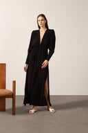 Model wearing Solid Plunge-Neck Maxi Dress front color black, made from 100% viscose, styled for a dinner look