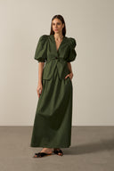 Model wearing the Solid Puff-Sleeved Blouse dark green front from the HS25 with 98% cotton 2% elastane styled for a lunch look.    