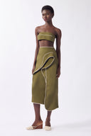 Model wearing the Solid Ruffled Midi Skirt look, color green, made from 98% cotton 2% elastane, styled for a resort look