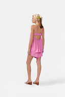 Model wearing the Solid Top and Shorts Set back color pink, made with 90% viscose 10% polyester fabric, styled for resortwear look 