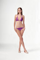 Model wearing the Solid Triangle Bikini look color purple with 85% Polyamide 15% Elastane, styled for a beachwear look