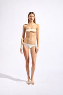 Model wearing the Solid Tulle Bandeau Bikini front color off whitewith 85% Polyamide 15% Elastane, styled for a beachwear look
