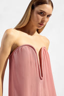 Model wearing the Solid V-Neck Strapless Maxi Dress detail showcasing its vintage rose color on 100% Viscose fabric, styled for an evening look.  