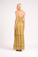 Model wearing the Strapless Beach Dress back, color unique, made from 100% viscose, styled for dinner look 