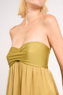 Model wearing the Strapless Beach Dress detail, color unique, made from 100% viscose, styled for dinner look 